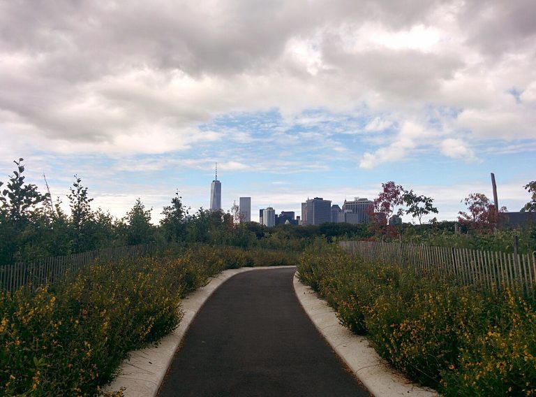 Liggett Terrace on Governors Island with the Manhattan skyline in the distance