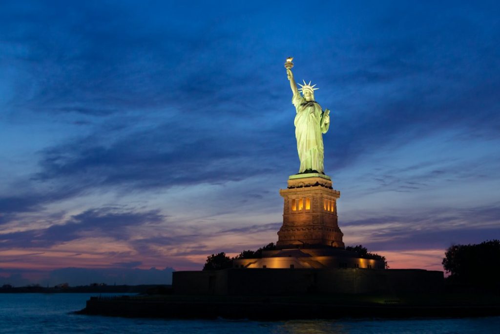 Statue of Liberty illuminated at dusk