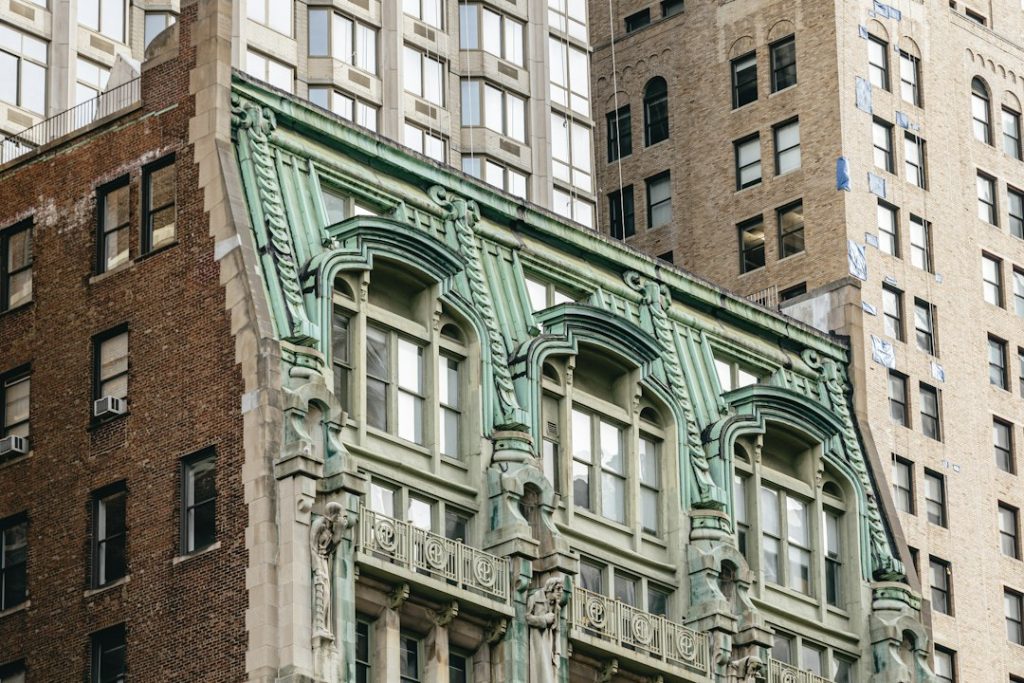 An ornate SoHo building façade with a projecting clock