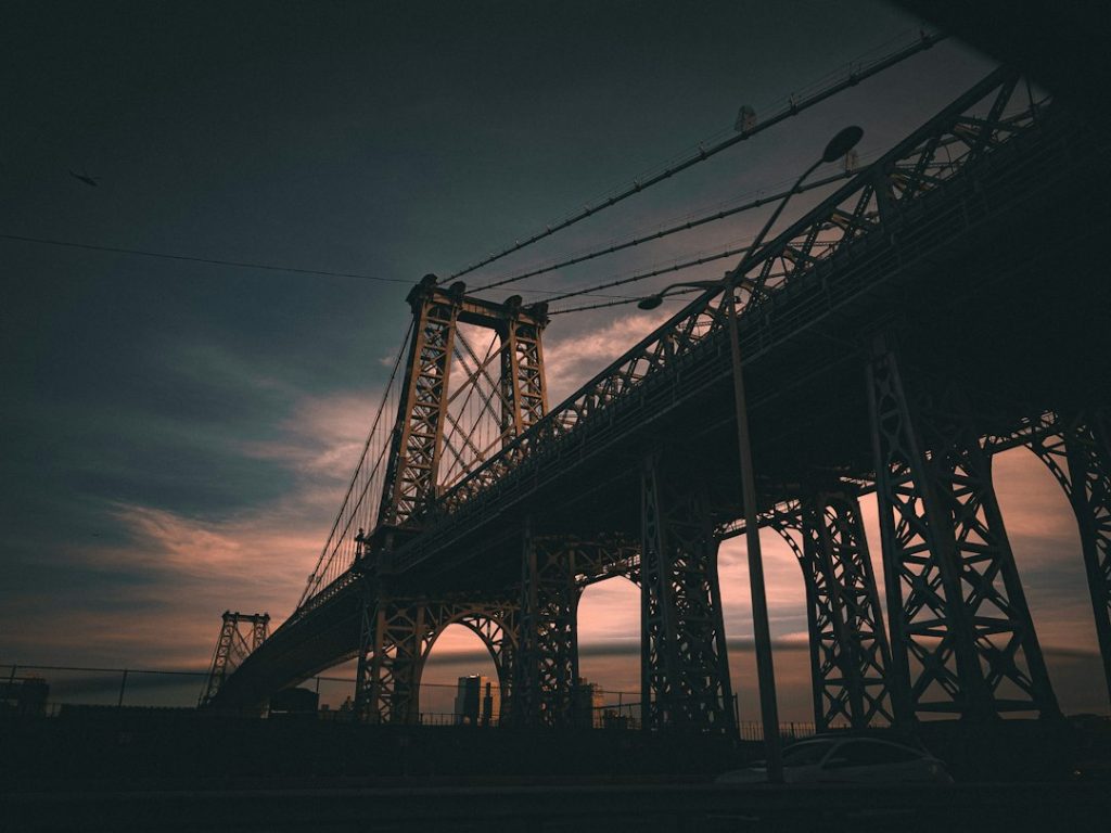 Williamsburg Bridge and its steel structure in evening light