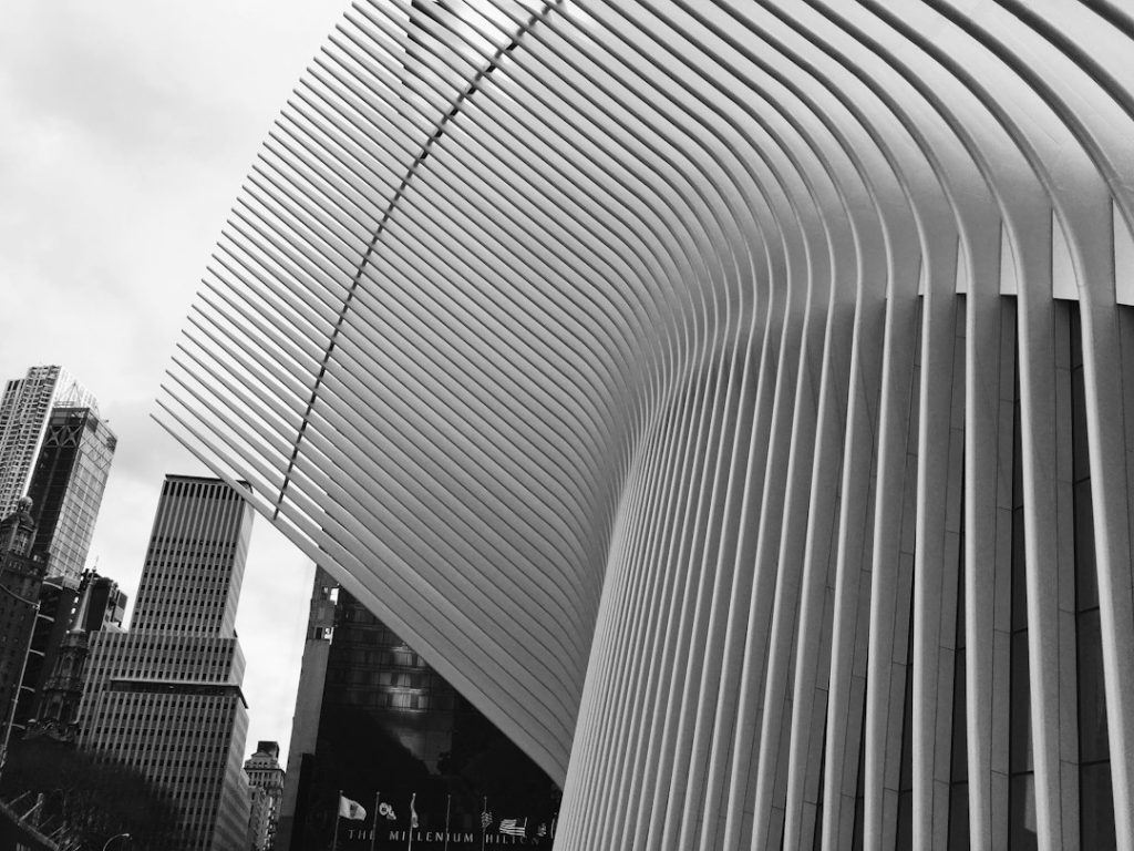 Black-and-white view of the Oculus exterior and surrounding buildings