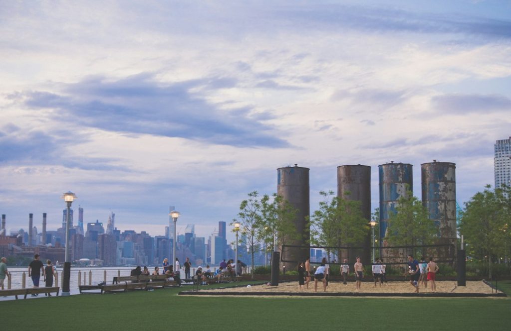 Lawn and waterfront walkway at Domino Park