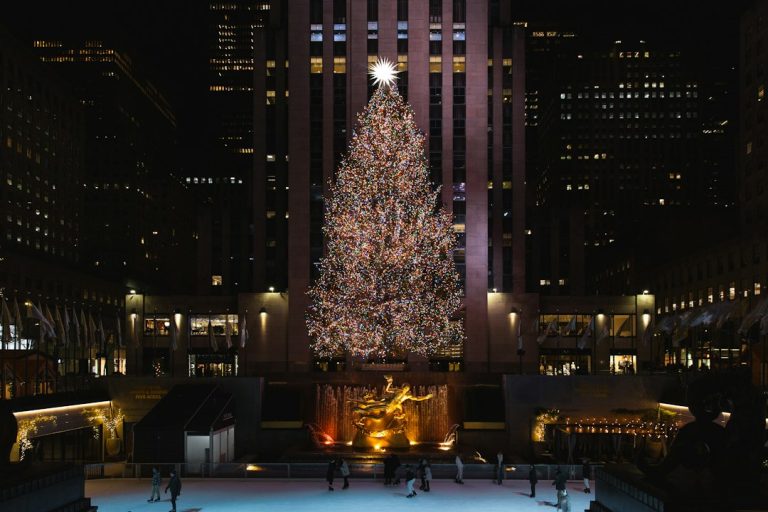 Rockefeller Center Christmas tree and rink illuminated during a previous holiday season