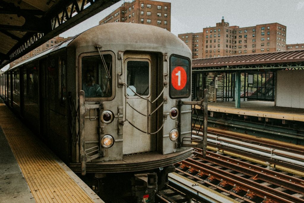 A silver subway train at a station