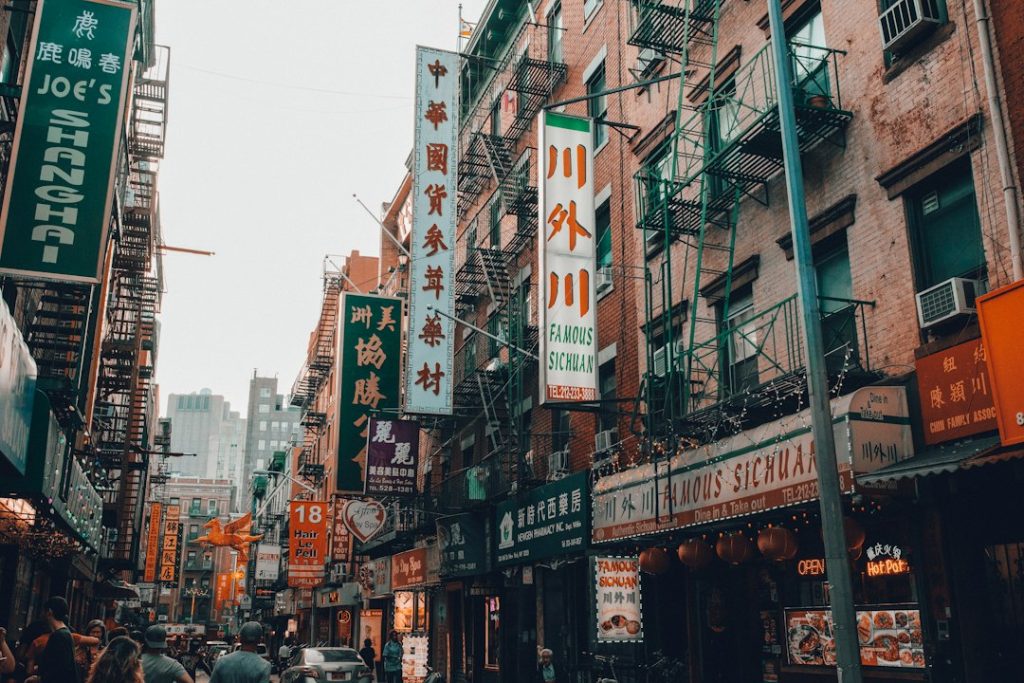 Street signs and buildings in Chinatown, Manhattan