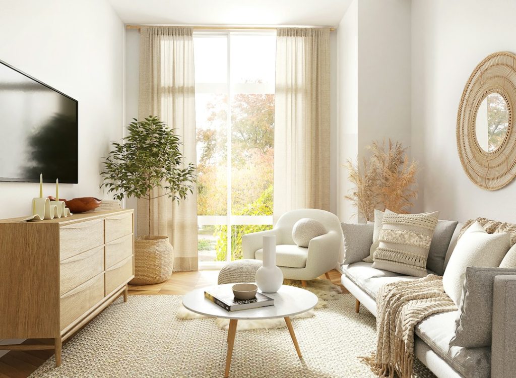 Sunlit living room with a leafy plant, cream seating and warm wood furniture