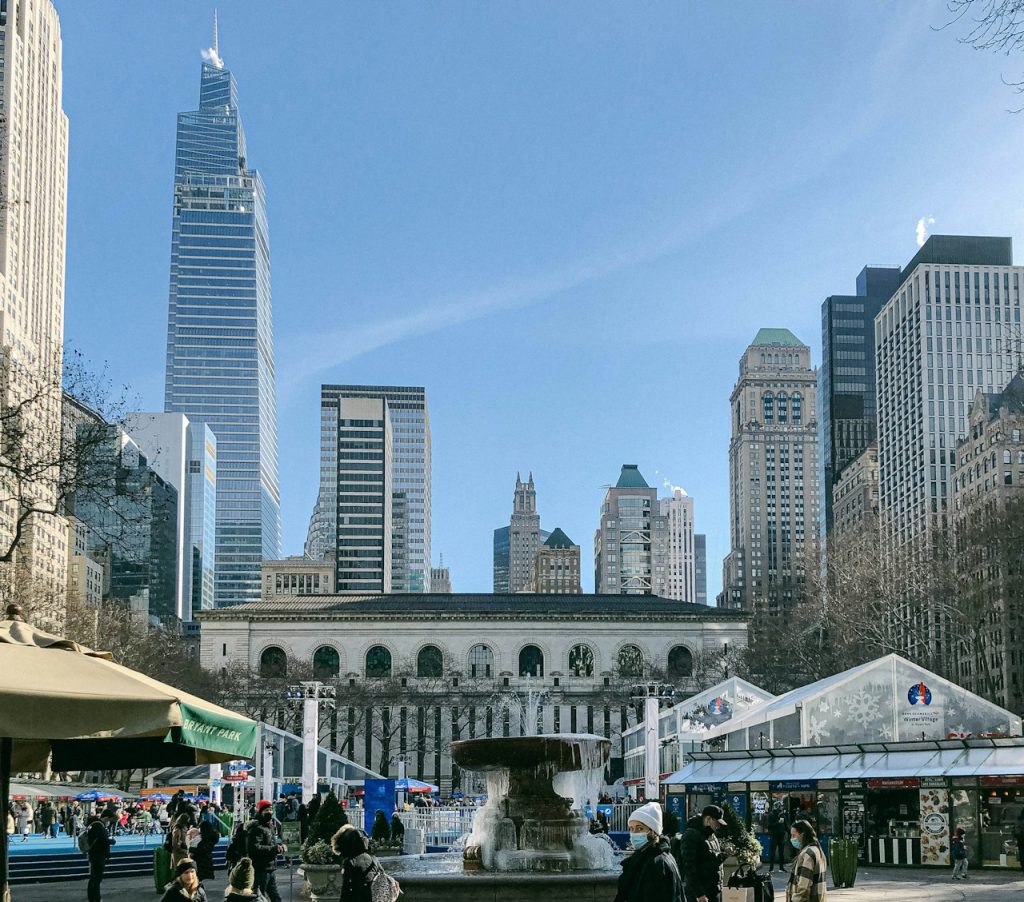 Bryant Park Winter Village stalls with the New York Public Library behind them