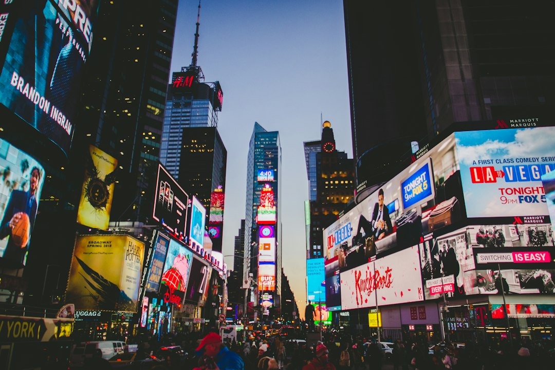 Buildings and pedestrians around Times Square in Manhattan