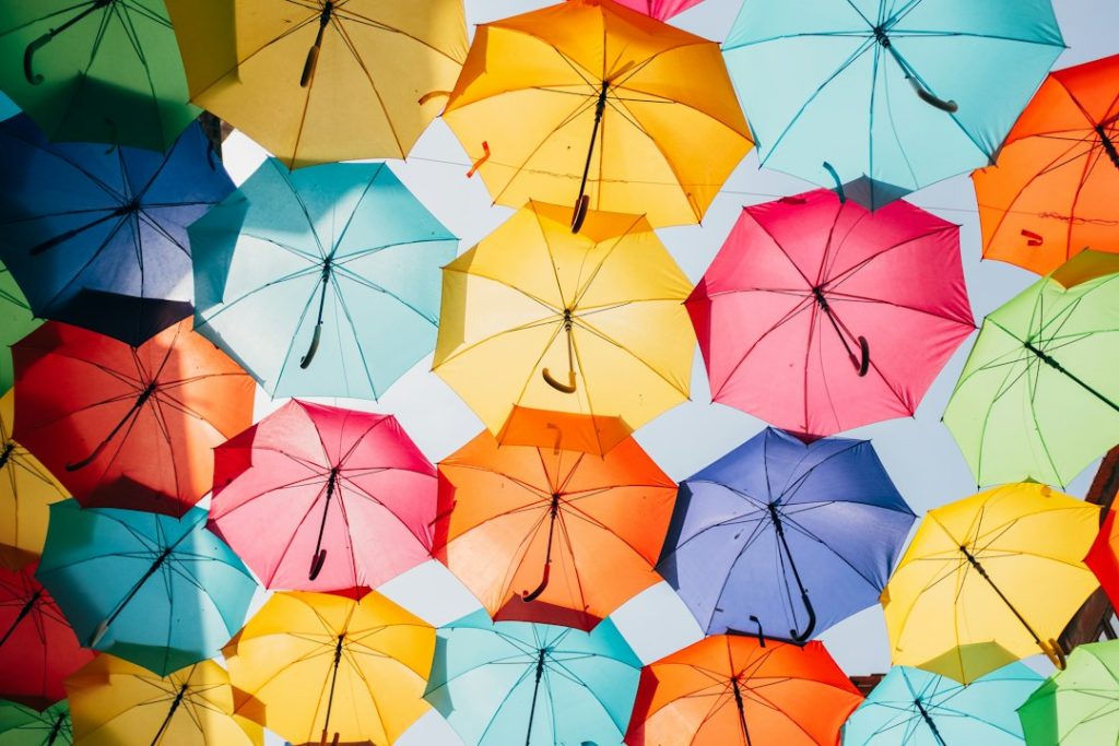 A bright display of colorful umbrellas viewed from below