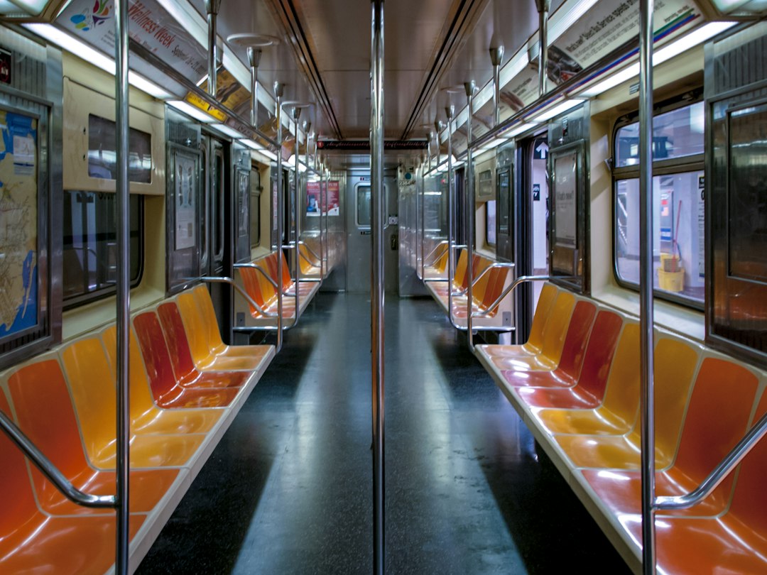 Orange and yellow seats inside a New York subway carriage