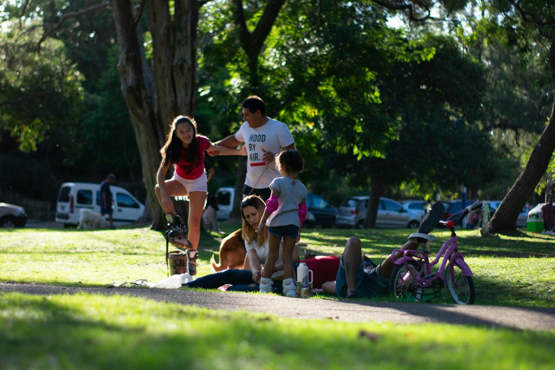 A family spending time together on a sunny green lawn