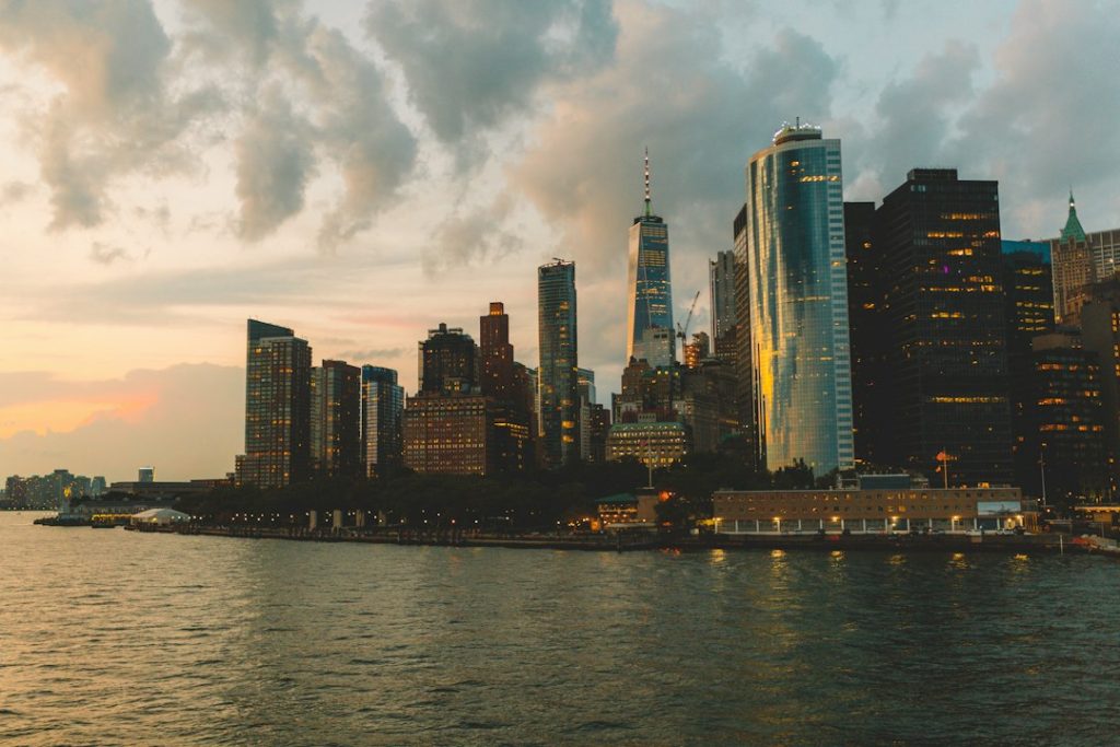 Manhattan waterfront buildings across the river at night