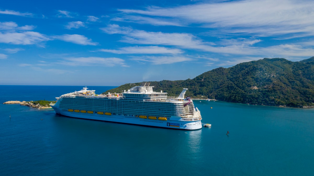 Cruise ship surrounded by blue water, illustrating a cruise vacation