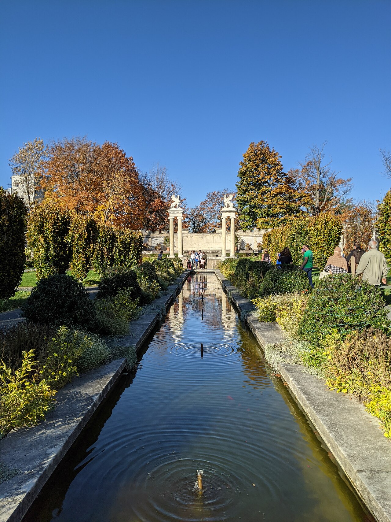 Reflecting channel and autumn trees in the Walled Garden at Untermyer Gardens